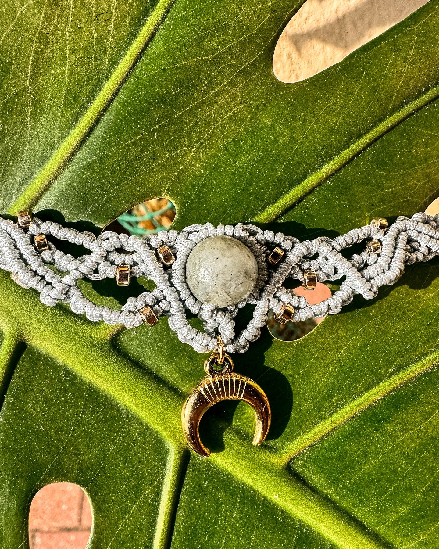 Macrame necklace with labradorite and the symbol of the Moon