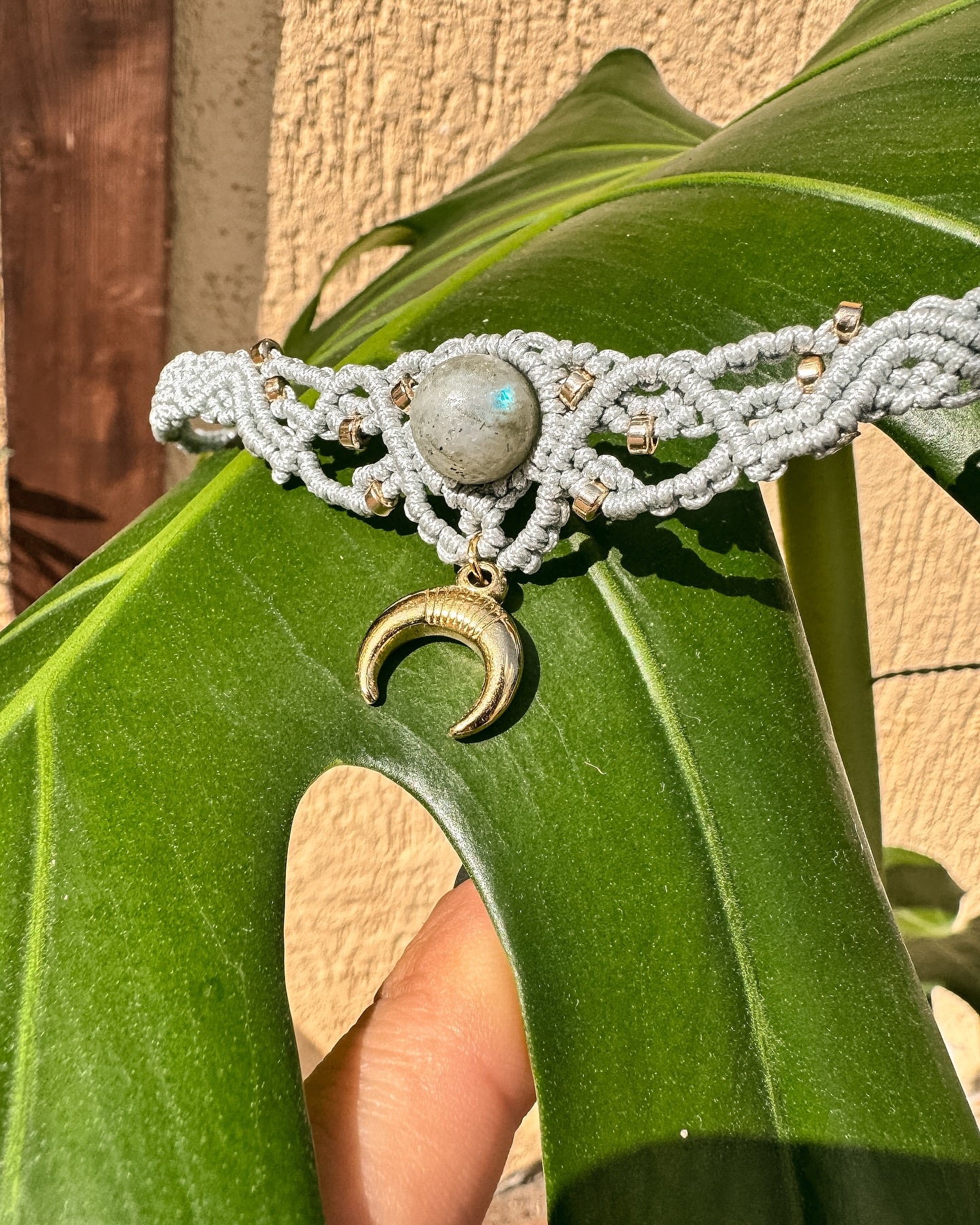 Macrame necklace with labradorite and the symbol of the Moon