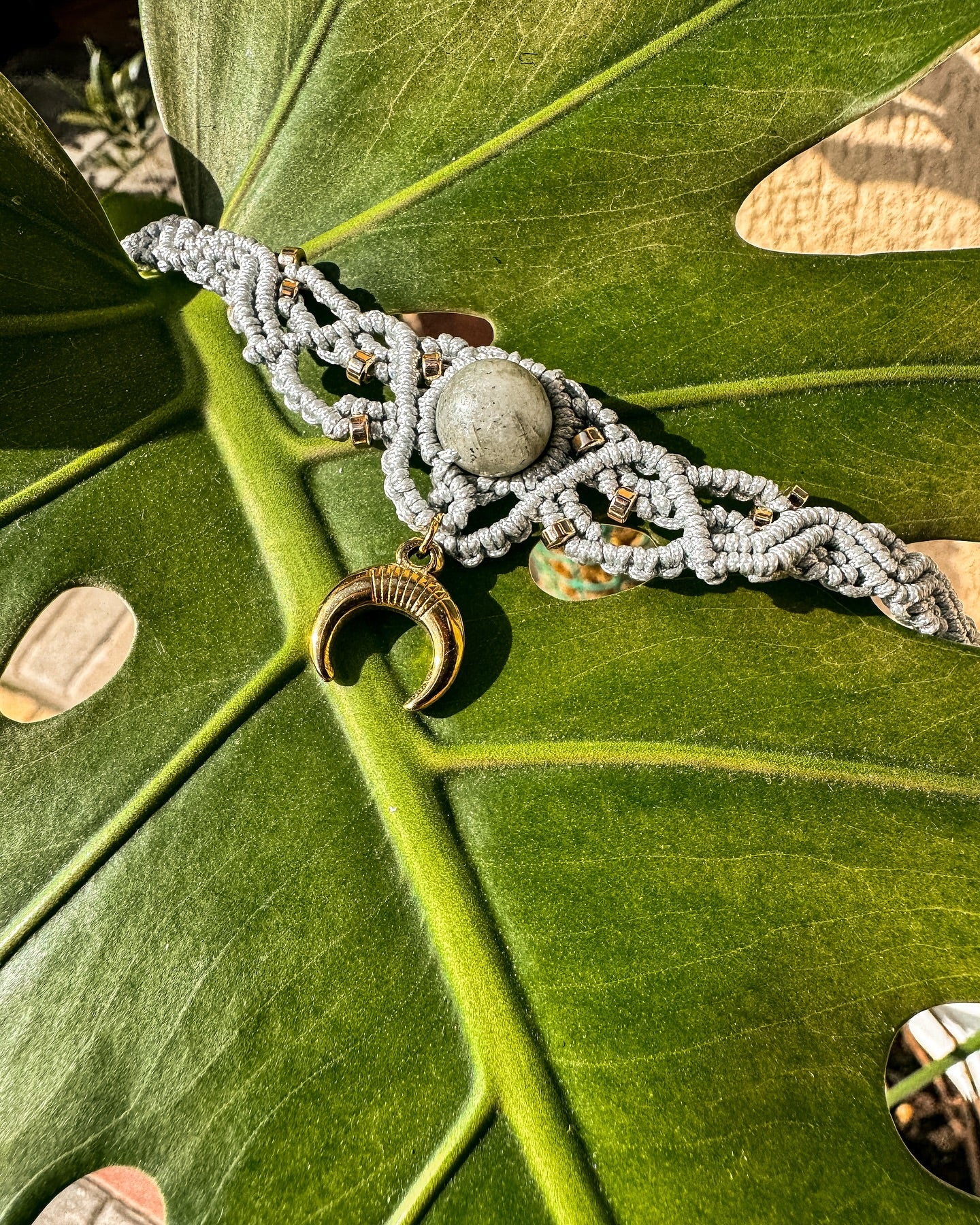 Macrame necklace with labradorite and the symbol of the Moon